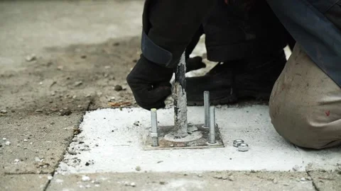 Construction worker tightens a Bolt with a metal Wrench Stock Footage 268794543