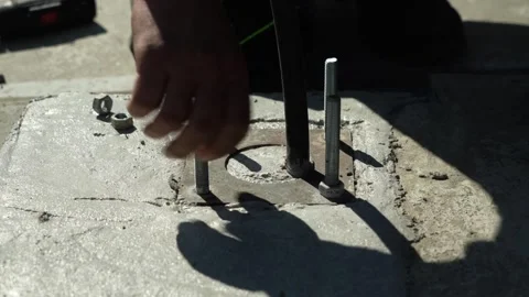 Construction worker tightens a Bolt with a metal Wrench Stock Footage 277413276
