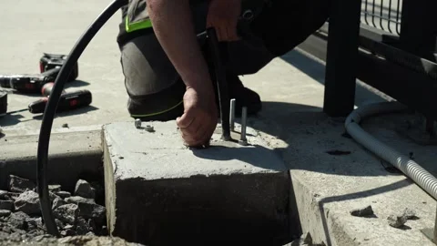 Construction worker tightens a Bolt with a metal Wrench Stock Footage 277413280