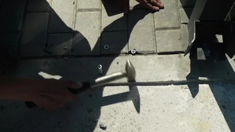 Construction worker tightens a Bolt with a metal Wrench Stock Footage 277413292