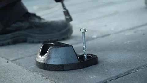 Construction worker tightens the screws using an electric drill Stock-Footage 261500546