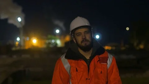 Construction worker tired and standing asleep in the twilight.overworking.4k Video stock 83761279