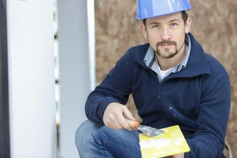 Construction worker with trowel and float Stock Photos