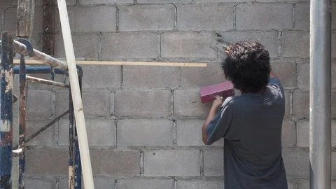 Construction worker with trowel plastering a wall. Stock Footage 126649151
