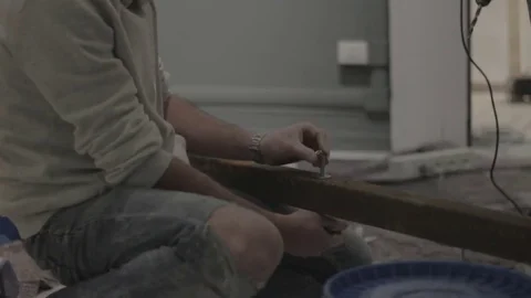 Construction worker turning bolt Stock-Footage 69767112