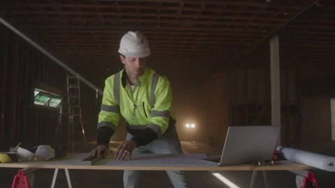 Construction Worker Typing On Laptop &amp; Writing Notes Stock Footage 270388638