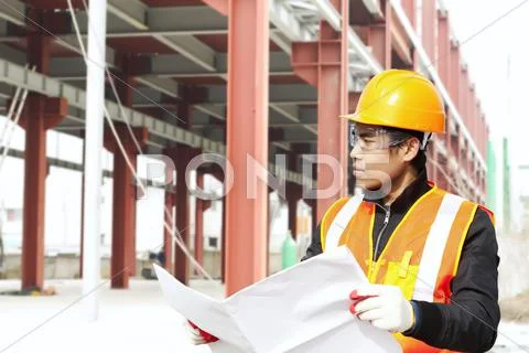 Construction worker under new building Stock Photos