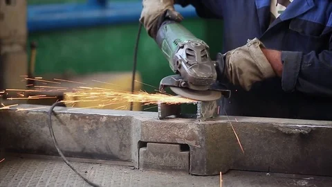Construction worker using an angle grinder producing a lot of sparks. Stock Footage 70208032