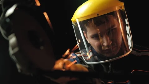 A construction worker using an angle grinder throwing sparks. Work safety Stock Footage 99269958