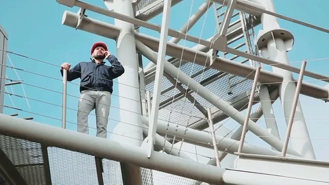 Construction worker using cell phone Stock Footage 73470567