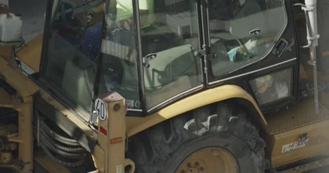 Construction worker using the control levers of a digger machine Video stock 141149450