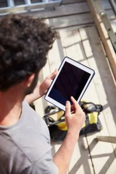 Construction Worker Using Digital Tablet On Building Site Stock Photos