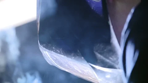 Construction worker using electric welding machine and making sparks fire flakes Stock Footage 117719045