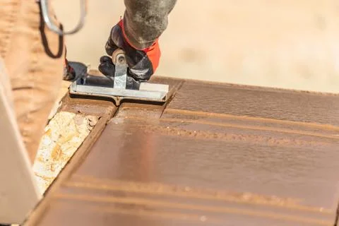 Construction Worker Using Hand Groover On Wet Cement Forming Coping Around Ne Stock Photos