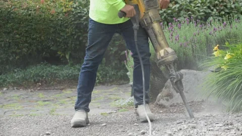 Construction worker using Jackhammer on concrete  Stock Footage 243771868