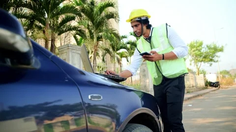Construction worker using laptop and mobile Stock Footage 277036111