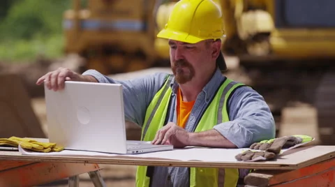 Construction worker using laptop computer Stock Footage 47820904