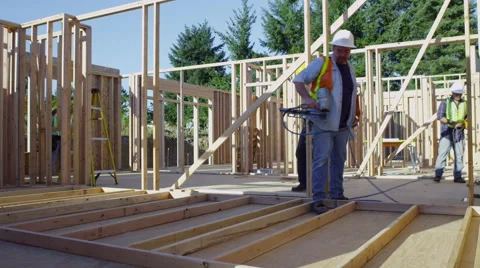 Construction worker using nail gun Video stock 47530554