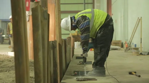 Construction Worker Using Power Drill On Construction Site 2 Stock Footage 46593572