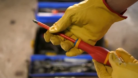Construction worker using Screwdriver. Worker with yellow gloves. Toolbox. Stock Footage 126331638