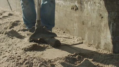 Construction Worker using a Steel tamper Stock-Footage 255856632