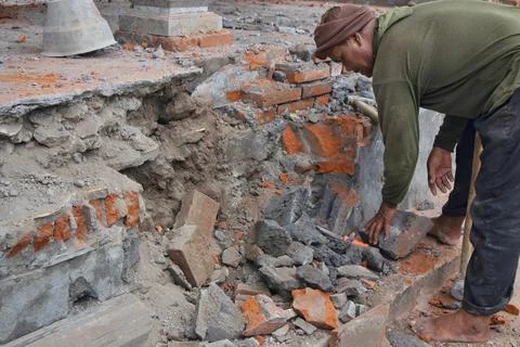 Construction worker using tools at construction site Stock Photos