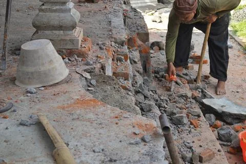 Construction worker using tools at construction site Stock Photos