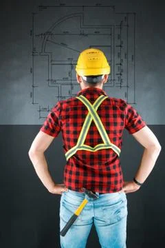 Construction Worker views the building plan. Stock Photos