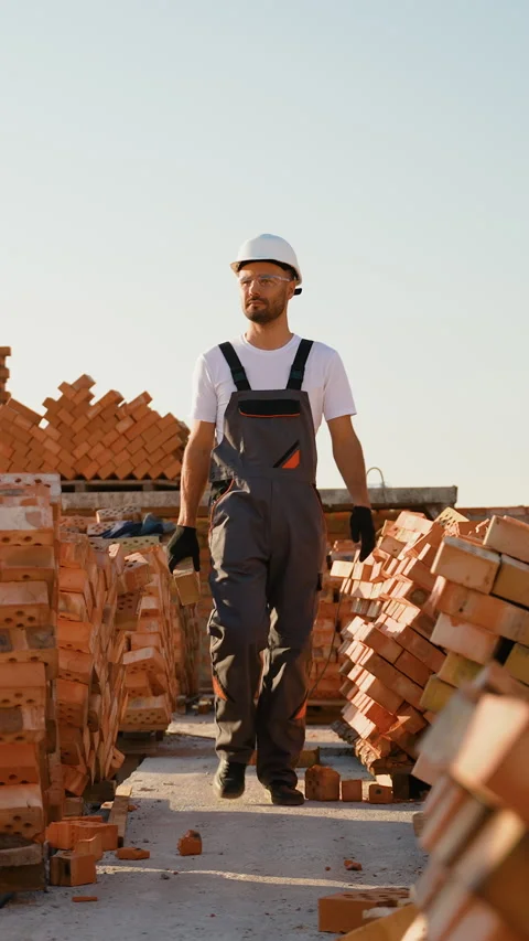 Construction Worker Walking on a Building Site Stock Footage 293642525