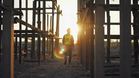 Construction Worker Walking on Site at Sunset Vídeos de archivo 317362870