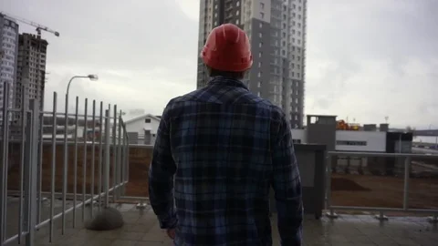Construction worker walking to watch cunstruction processes Stock Footage 69806869