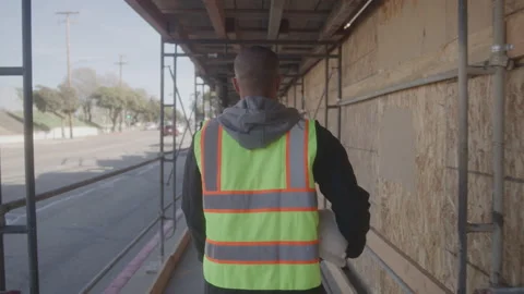 Construction Worker Walking to Work Site Stock Footage 208804094