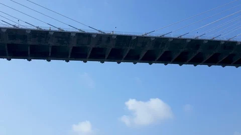 Construction worker waves from unfinished Atlantic Bridge-POV Video stock 108203631