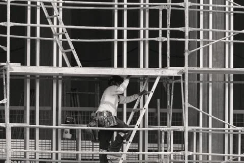 Construction worker wearing high-visibility clothing and protective equipment Stock Photos