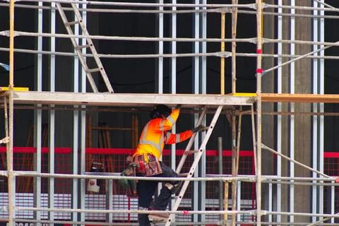Construction worker wearing high-visibility clothing and protective equipment Stock Photos