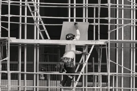 Construction worker wearing high-visibility clothing and protective equipment Stock Photos
