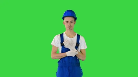 Construction worker wearing protective gloves on a Green Screen, Chroma Key. Stock Footage 157058889