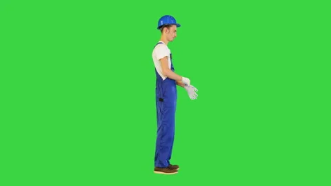 Construction worker wearing protective gloves on a Green Screen, Chroma Key. Stock Footage 157243135
