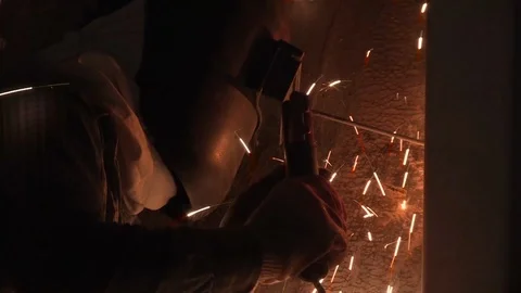 Construction worker welding in the dark construction site Stock Footage 99809058