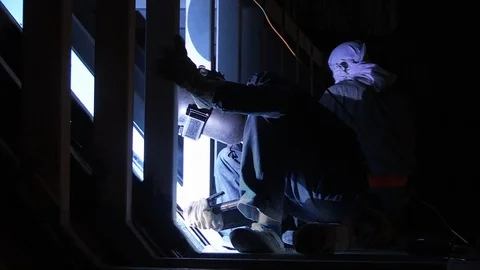 Construction worker is welding in the night 库存影片 97905350