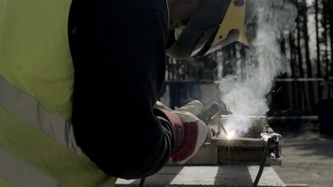 Construction worker welds a piece of metal Stock Footage 71124183