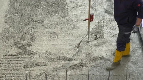 Construction worker when concreting a foundation base slab construction Stock Footage 61719007