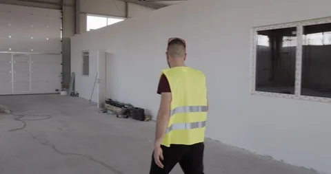 A construction worker while and looking for something. Stock Footage 127174412