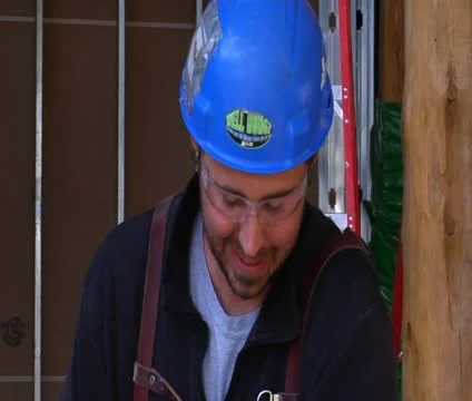 Construction worker wipes brow Stock Footage 21559217