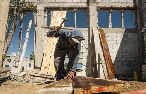 Construction worker working on building Stock Photos