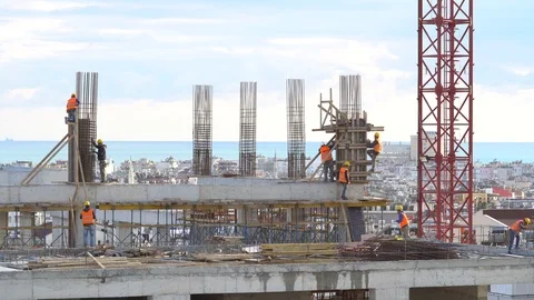 CONSTRUCTION Worker working with concrete iron near sunset Stock Footage 85610112