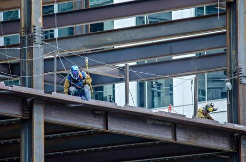 Construction worker working on highrise building construction worker worki... Stock Photos
