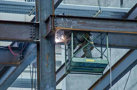 Construction worker working on highrise building construction worker worki... Stock Photos