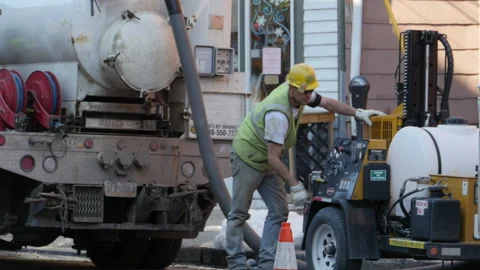 Construction worker working on road work in Pennsylvania USA Stock Footage 232975440