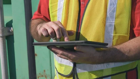 Construction Worker Working With a Touch Screen Tablet Device Stock Footage 93458740